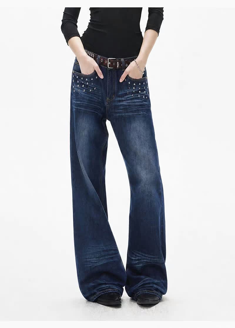 Model wearing dark blue wide-leg jeans with decorative pocket details